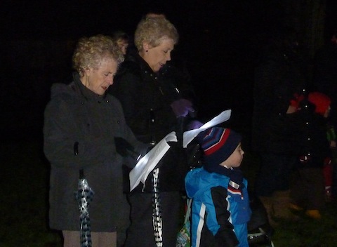 Singing along by torchlight.