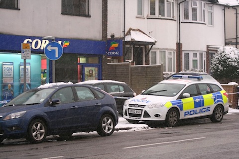 Surrey Police were called to Corals on Woodbridge Hill at cordoned off the area in front of the bookmakers.