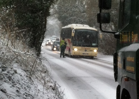 Snow go on the Farnham Road. A lorry driver consults a coach driver as large vehicles found uphill travel difficult on a road that some suspected had not been gritted