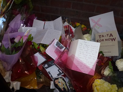 Some of the floral tributes with messages left at Guildford railway station in memory of Ryan Harrison who died there on Saturday.