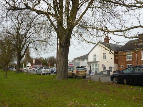 Pitch Place Worplesdon as it looks today – as a comparision to last week's vintage picture of the same view. For many years the car dealership was known as the Grosvenor Garage. The ship pub that can just be seen in last week's picture is an early building to the one there now. But the pub is now closed and its likely it will be pulled down and replaced by apartments.