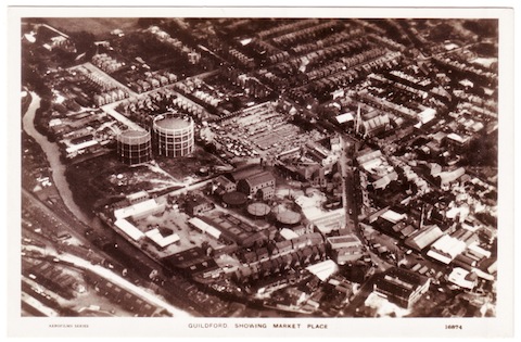 As soon as aircraft took to the skies, up went photographers to take aerial views. Some were published as picture postcards. Here's one of Guildford.