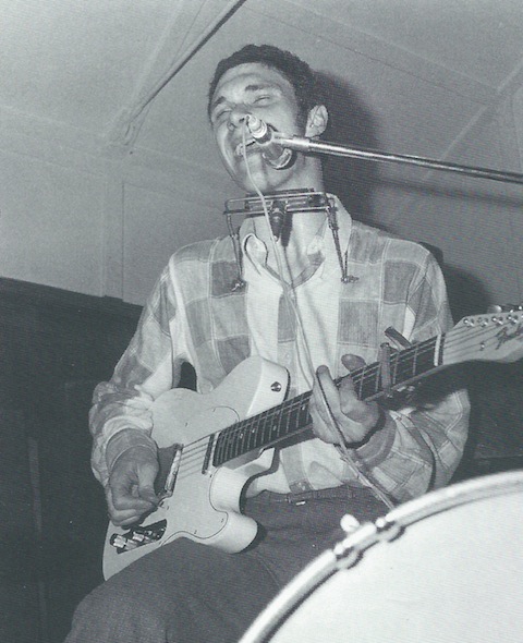 The late great Duster Bennett playing a white Fender Stratocaster guitar at Godalming's Gin Mill Club. Picture from Duster Bennett Jumping at Shadows, the authorised biography by MArtin Celmins.