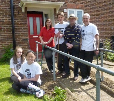 Matrix Trust volunteers wearing white T-shirts, from left: Sarah, Michelle, Johnnie and chairman Ian Nicholson, with community safety warden Tracy James and resident Alastair Montgomerie.