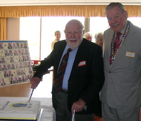 ... cuts the cake to celebrate the 3oth anniversary of Probus