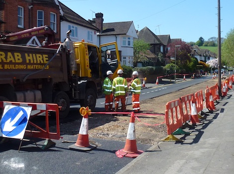 The project has been delayed by damage done to a water main during surface preparation. This final stretch affected by the water leak should be resurfaced by Thursday evening