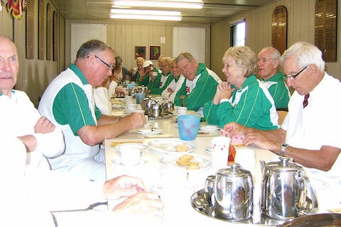 The opposing teams at Billingshurt enjoying a well earned cup of tea at half time. Castle Green members in green on the right hand side of the table, from right: Rob Williams, Viv Smith, Colin Downham, Hazel  Tappenden, Ann Bailey, Terry Smith (waving and with a white hat on), and Captain Diana Summerhayes. On left are Jim Horwood and Brian West.