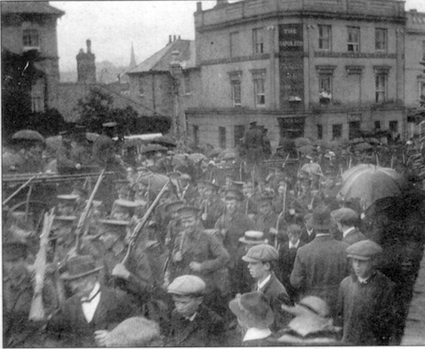 Off to the front: a rare photo of soldiers marching toeards Guildford railway station in August 1914 at the start of the First World War. Picture: David Rose collection.