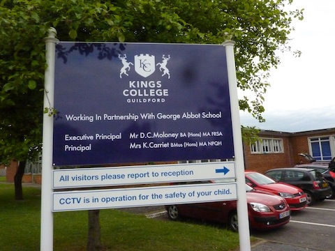 Signboard displaying the new Kings College logo.