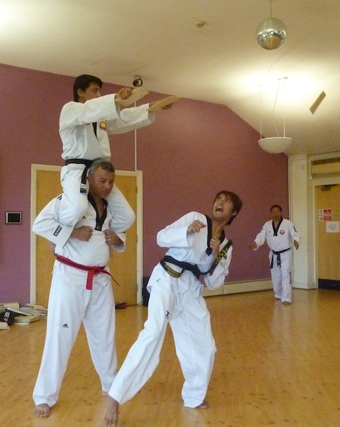 Members of Guildford's Nepalese community with their martial arts display – with wood splinters flying everywhere!