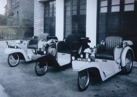 Examples of Nelco's electric Solotron cars, pictured outside the factory in Station Road, Shalford.