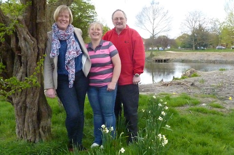 Community safety warden for Stoke Garry Jones, pictured with Cllr Zoe Franklin and Nikki King at the Moggy Pond in Bellfields. Garry has been working with the local community in the makeover project of the pond.