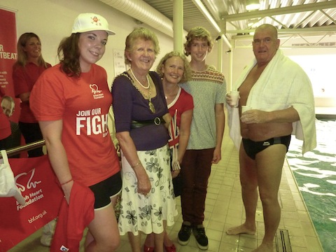 Patrick Fitzsimmons just after completing his 24-swim. Pictured with him, from left: Spirit's deputy manager Hayley Bollons; the Mayor of Guildford, Diana Lockyear-Nibbs; and Patrick's wife Carol, and son Thomas.