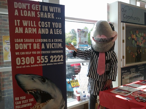 That shark and the Trading Standards Illegal Money Lending Team at Tesco, Guildford.