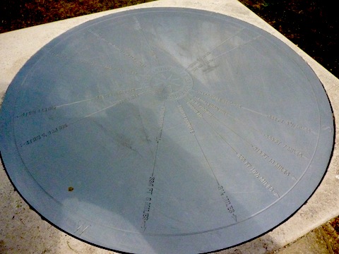 The circular plaque marking places 'in view'.