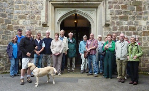 The history walker (and dog) with their guide David Rose pictured at St Mary's Church in Perry Hill.