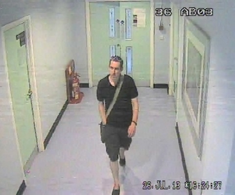 CCTV image of the man Surrey Police want to contact.