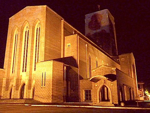 Guildford Cathedral with the Poppy Appeal emblem projected on to the tower.