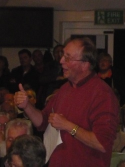 Graham Hibbert speaking at a residents meeting in Burpham.