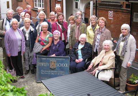 The group pictured at their visit to their former school.