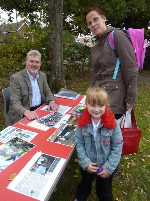 John Thurlow of the Surrey Lifelong Learning Partnership talks to a local mum and her daughter.