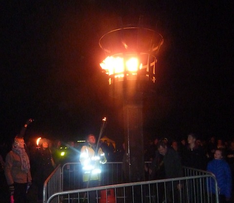 Lighting the beacon in Stoke Park.