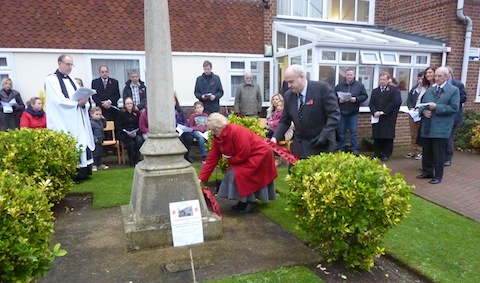 Wreaths being laid by Val and Nigel Crompton.