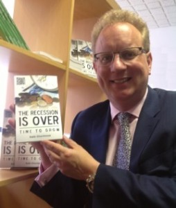 Keith Churchouse with his book The recession is over: time to grow