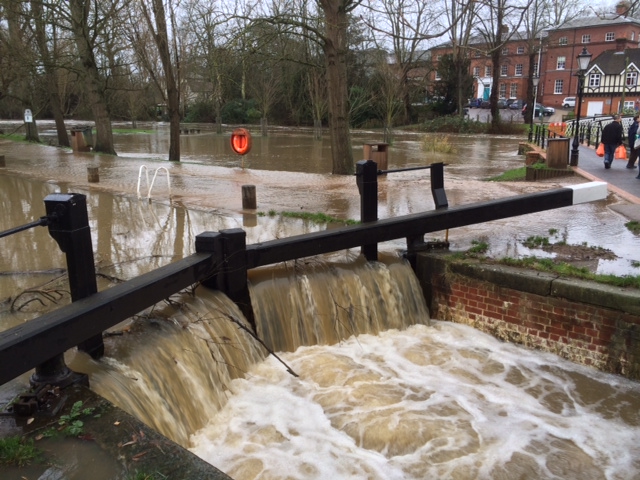 Wart pours over the lock gates at Millmead as the river level starts to overflow.