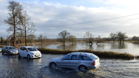Easy does it: the extend of the flooding can be seen in the water meadows beyond.
