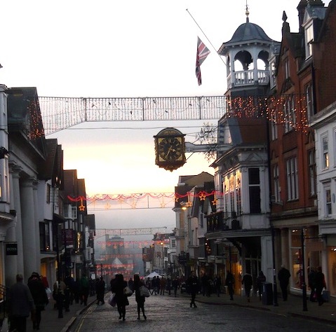 Late afternoon in Guildford High Street with the mist still lurking. Certain landmarks can be seen such as St Nicolas' Church, but the trees on The Mount are hidden.