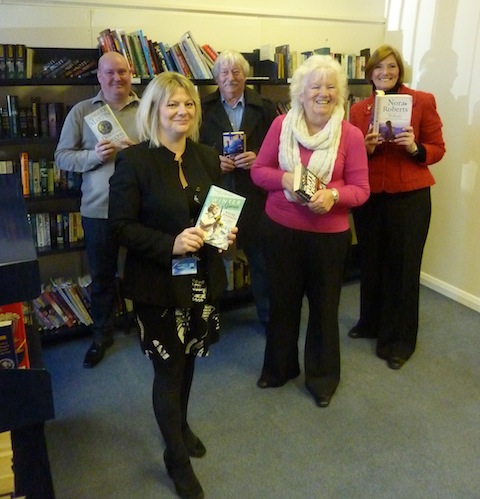 Seen from left: the chairman of the Westborough and Park Barn Community Association, Wayne McShane; Kings College principal Kate Cattiett; Roy and Shirley Arthur who came to borrow some books; and Guildford West county councillor and all round community supporter, Fiona White.