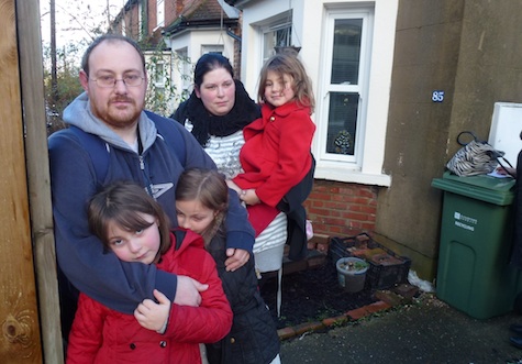 Trevor West, his partner Vanessa Sewell and there thre daughters, outside their uninhabitable Walnut Tree home.