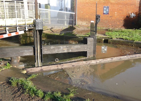 The level was still just below the top of the lock gates but was still gradually rising.