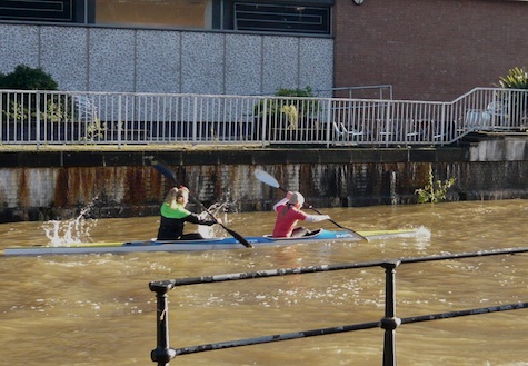 Canoeists enjoying the challenge of the fast flowing water.