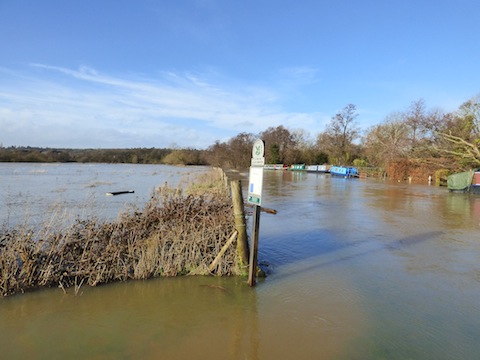 The River Wey and flooded meadows, looking downstream, from Broadford Road, Shalford on Saturday.