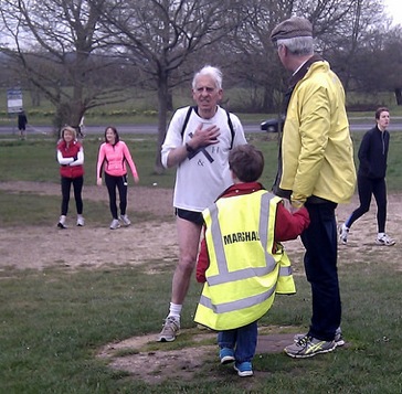 Wearing a hi vis jacket is a very young marshall before the start of the run. He provided some very enthusiastic clapping and cheering as the runners went by.