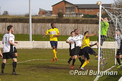 Goalmouth action between Cinderford Town and Guildford City.