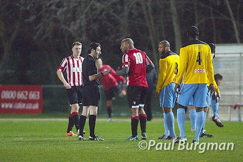 The ref has a word with City lance Barton-Brown.