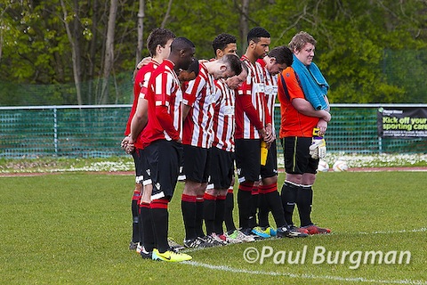 Guildford City players observe the two-minute silence in memory of the 25th anniversary of the Hillsborough disaster.