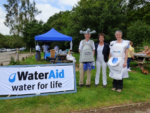 Guildford MP Anne MIlton (centre) with Water Aid volunteers Alan Findlay and Katie Lillington.