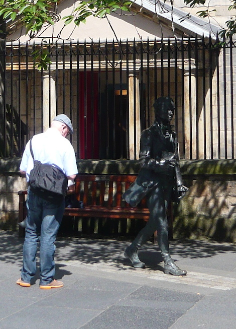 The life sized statue of poet Robert Fergusson, who inspired for Robert Burns, outside the Kirk of the Canongate.
