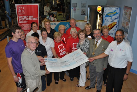 Maurice Taylor donates cheque to the British Heart Foundation at Spectrum with the Mayor of Guildford, David Elms, present.