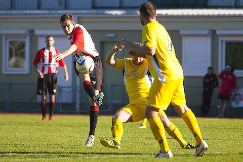 Anthony Baker shoots for Guildford City.