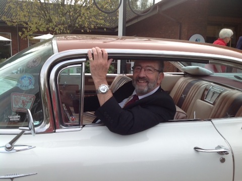 The Mayor of Guildford, David Elms, pictured in a classic American car parked out the Holiday Inn by owner Rockin' Roy Hunt.