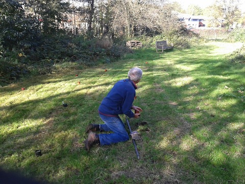A volunteer plants primroses and cowslips in a new wildflower area at Dapdune Wharf.