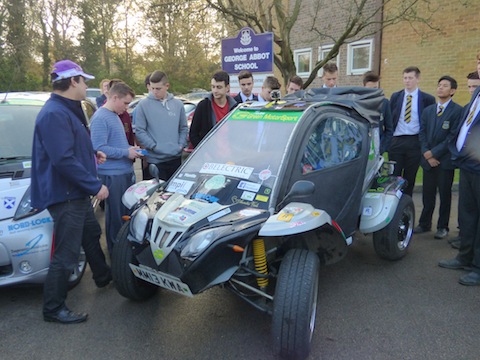 Students hear Gordon Foat talk about his electric buggy.