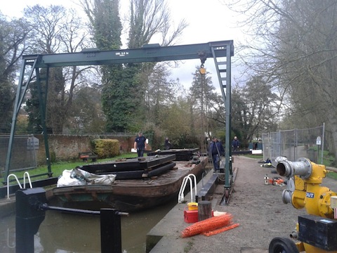 With limited vehicle and machinery access along the Wey Navigation, new lock gates have to be floated on to site by barge and then lifted into place manually using a block and tackle.