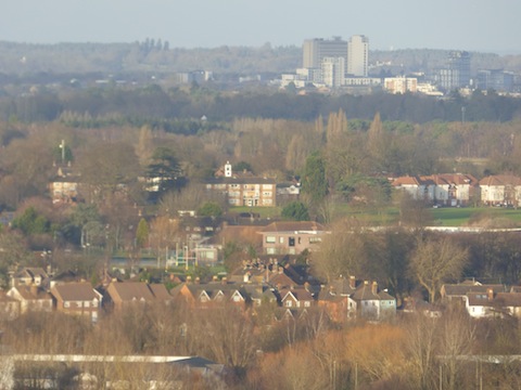 A view, using a telephoto len,s from The Mount looking across the north Guildford area with Woking in the distance.