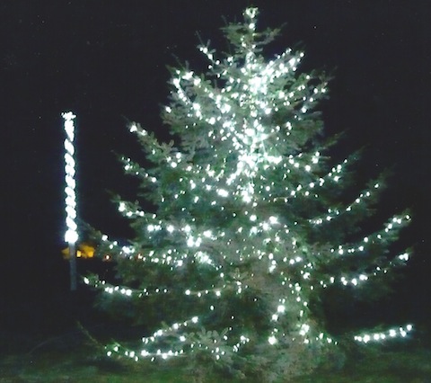 The Christmas tree and maypole on Wood Street Village all lit up.
